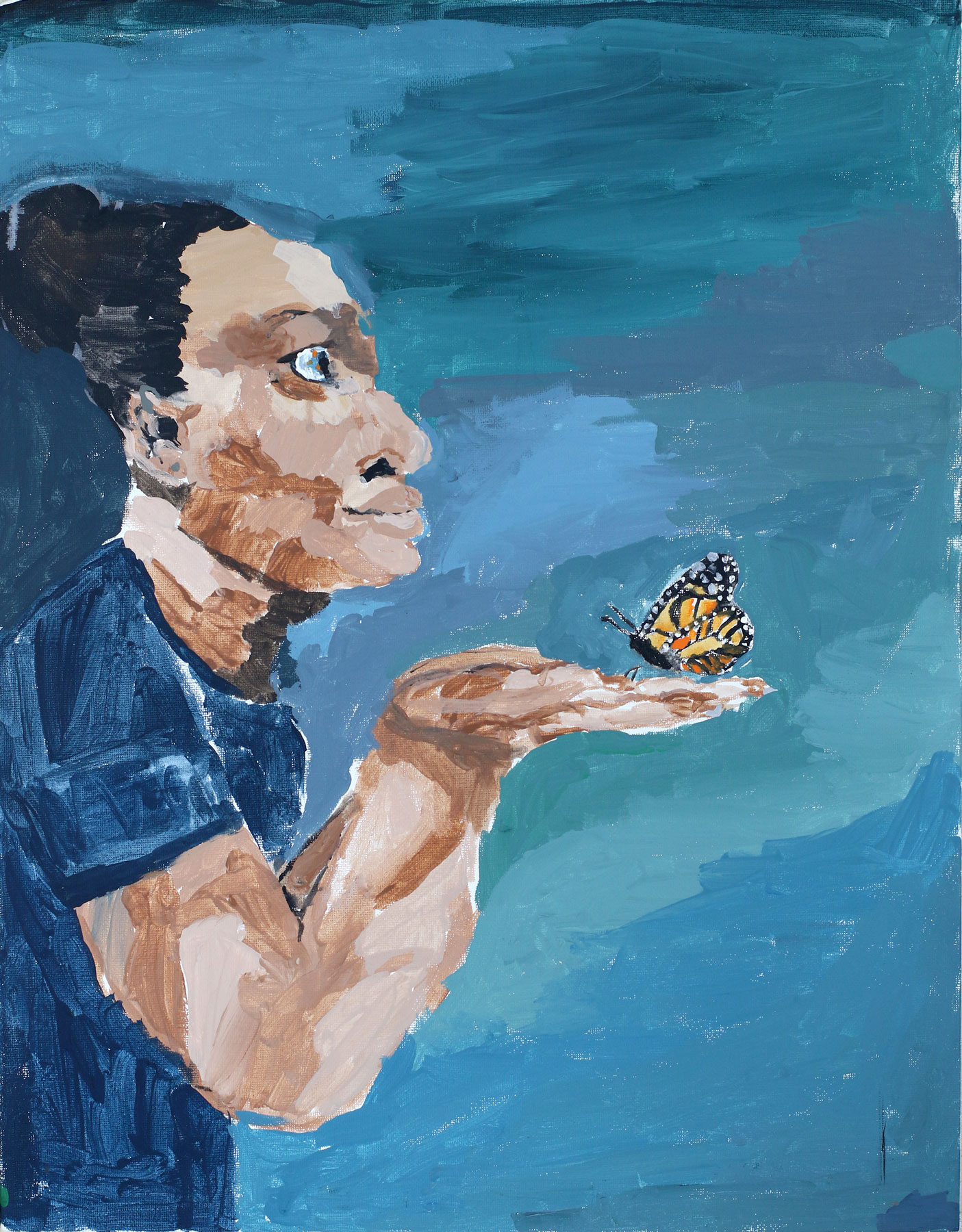 A woman holds a monarch butterfly in her palm